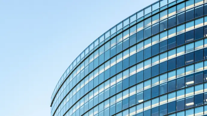 Top of commercial building made up of glass windows