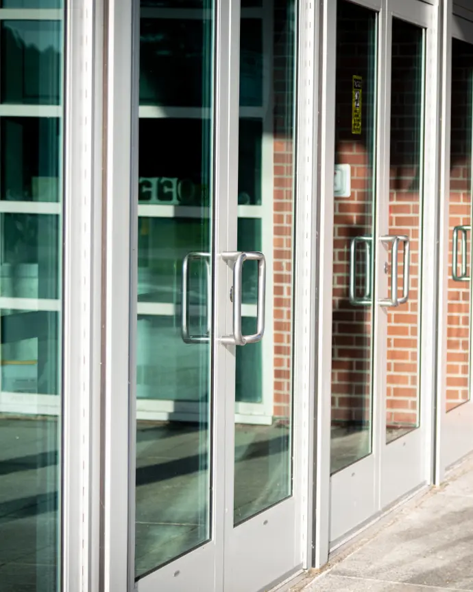 Large white doors with large windows and silver handles